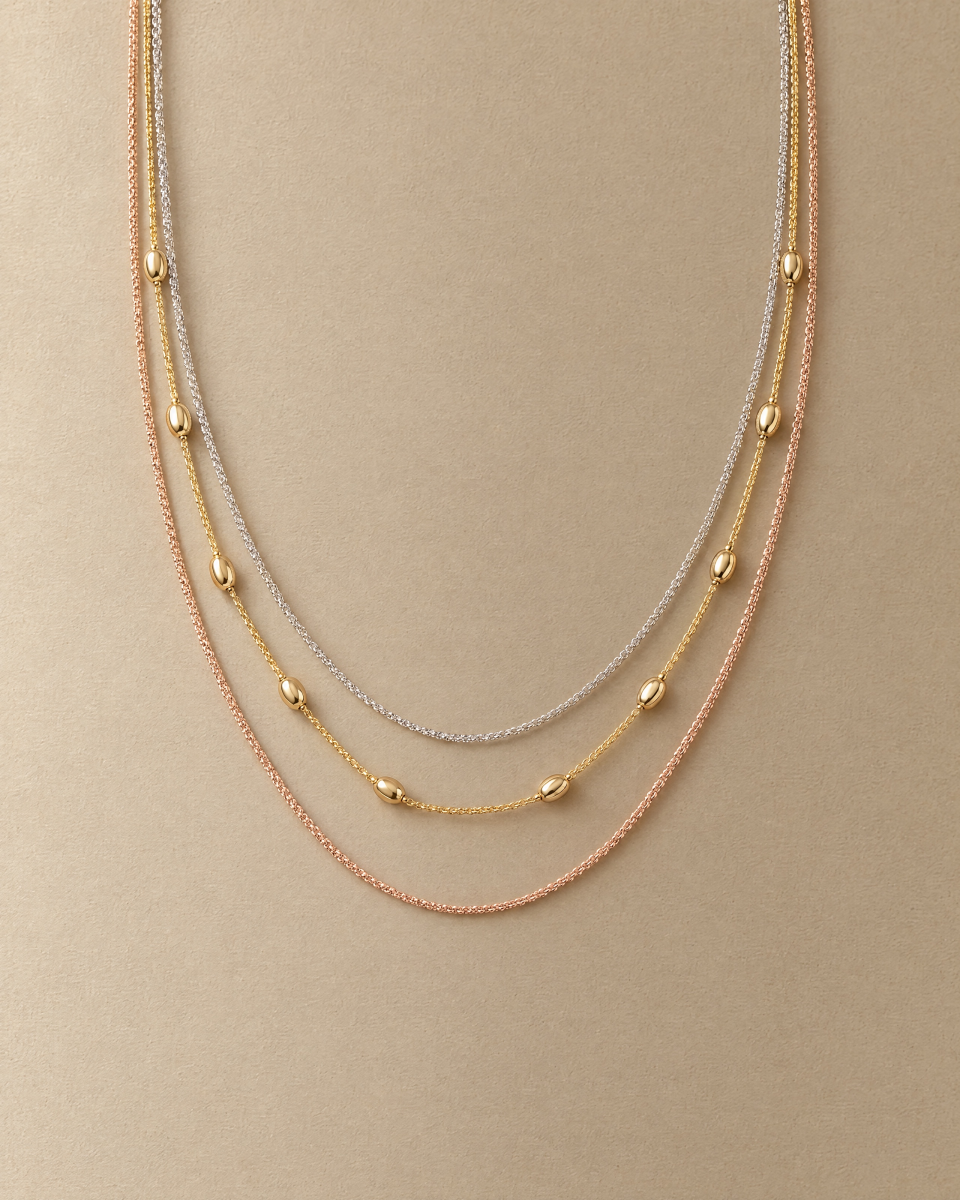 The layered necklace in a still-life photograph