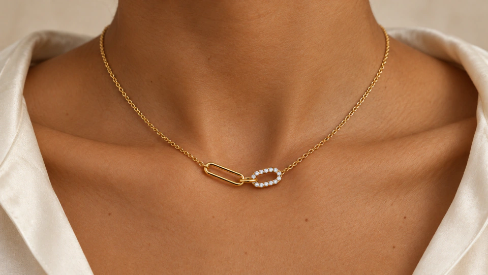 The oval-link necklace worn at the neckline