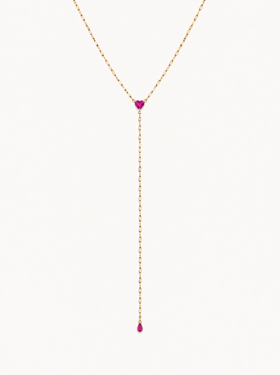 The pink-heart lariat with a fine gold-tone Y chain, central pink heart and very tiny pink teardrop terminal, on a light background